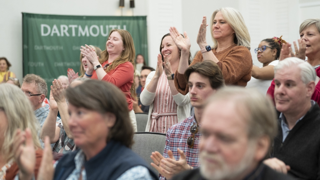 People standing and clapping